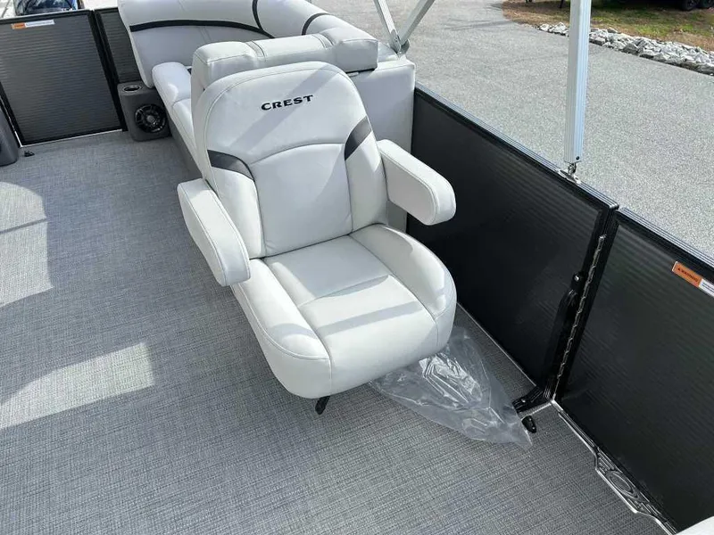 Slide: The Image of 2024 Crest Classic LX 220 SLC boat seat, luxurious white upholstery, spacious deck. - 8
