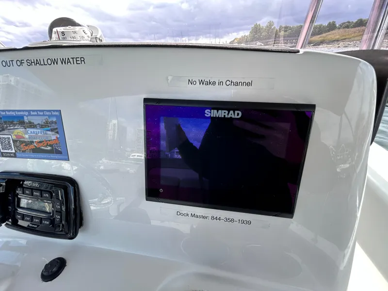 Slide: The Image of Simrad display on 2021 NauticStar 2102 Legacy boat dashboard. - 7