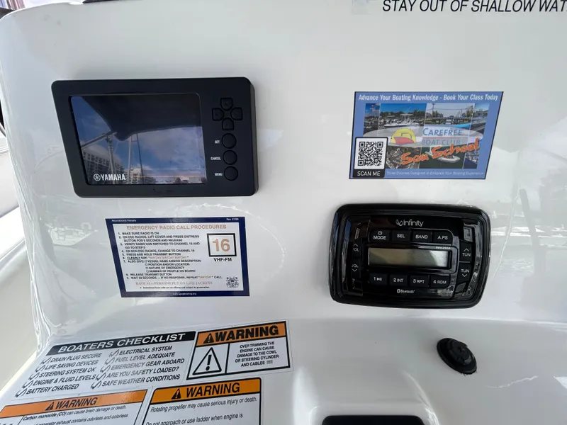 Slide: The Image of Control panel of 2021 NauticStar 2102 Legacy boat with Yamaha display and Infinity stereo. - 8