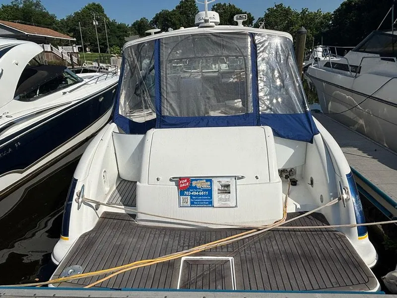 Slide: The Image of 2006 Formula 400 Super Sport boat docked, featuring a "For Sale" sign. - 1