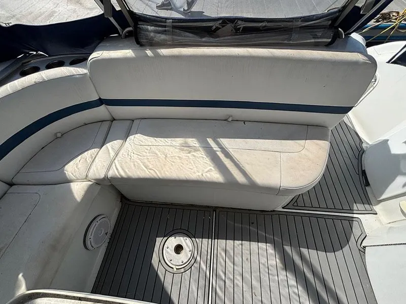 Slide: The Image of 2006 Formula 400 Super Sport boat interior with white seating and gray flooring. - 10