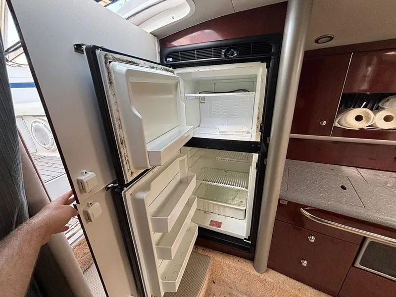 Slide: The Image of Open refrigerator inside a 2006 Formula 400 Super Sport boat cabin. - 11