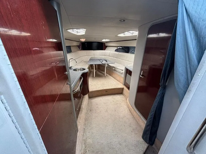 Slide: The Image of Interior of 2006 Formula 400 Super Sport yacht with seating and kitchenette. - 12