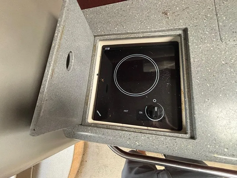 Slide: The Image of Built-in stove on 2006 Formula 400 Super Sport boat, featuring a sleek, compact design. - 14