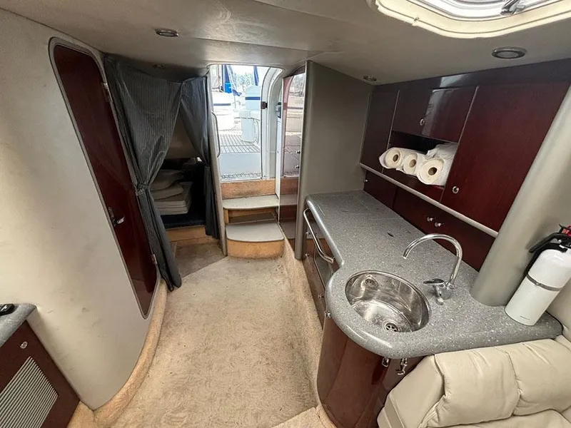 Slide: The Image of Interior of a 2006 Formula 400 Super Sport yacht with kitchenette and seating area. - 18