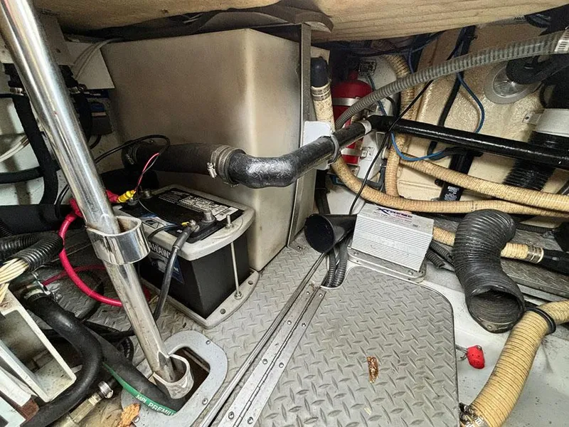 Slide: The Image of Engine compartment of a 2006 Formula 400 Super Sport boat, showing battery and wiring. - 20