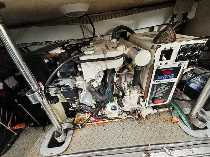 Slide: The Image of Engine compartment of a 2006 Formula 400 Super Sport boat, showcasing mechanical components. - 23