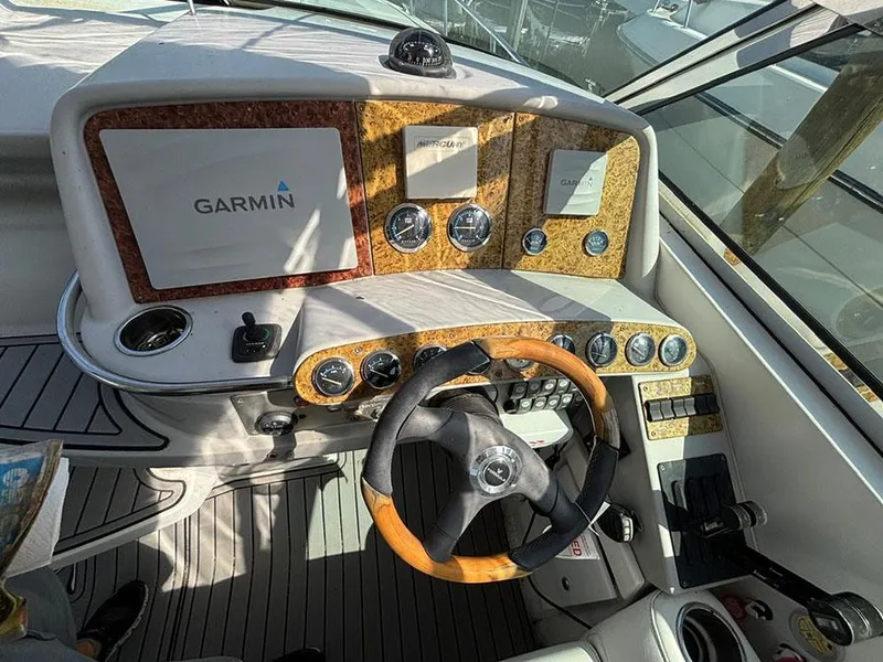 Slide: The Image of Cockpit of 2006 Formula 400 Super Sport with Garmin navigation system and wood-accented steering wheel. - 3