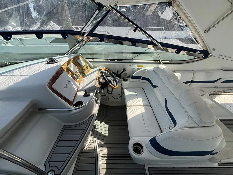 Slide: The Image of 2006 Formula 400 Super Sport boat interior with white seating and navigation controls. - 4