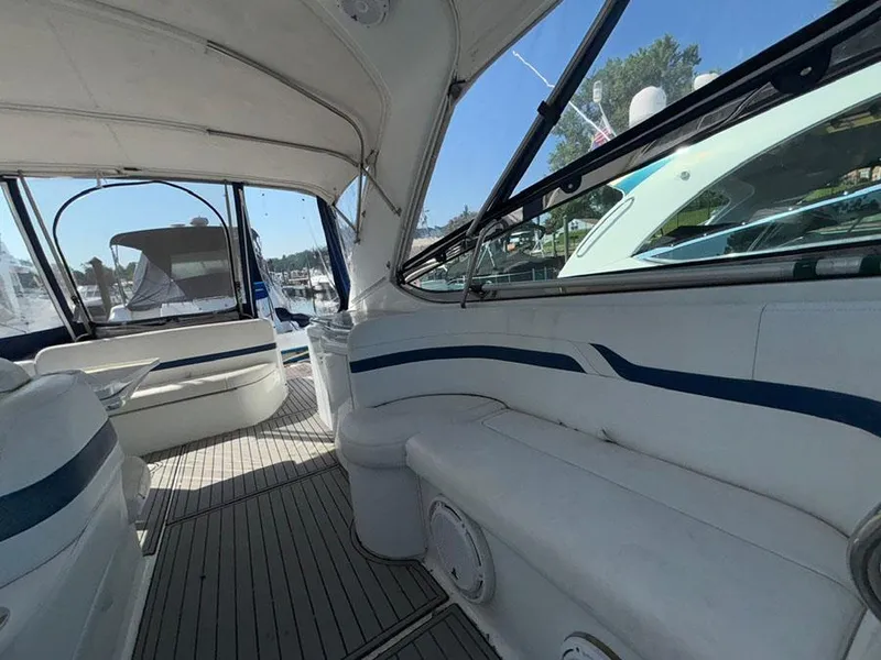 Slide: The Image of Interior of a 2006 Formula 400 Super Sport yacht with white seating and blue accents. - 5