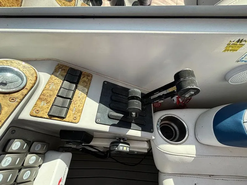 Slide: The Image of Control panel of a 2006 Formula 400 Super Sport boat with throttle levers and switches. - 7