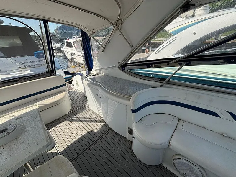 Slide: The Image of Interior view of a 2006 Formula 400 Super Sport yacht, featuring seating and a table. - 8