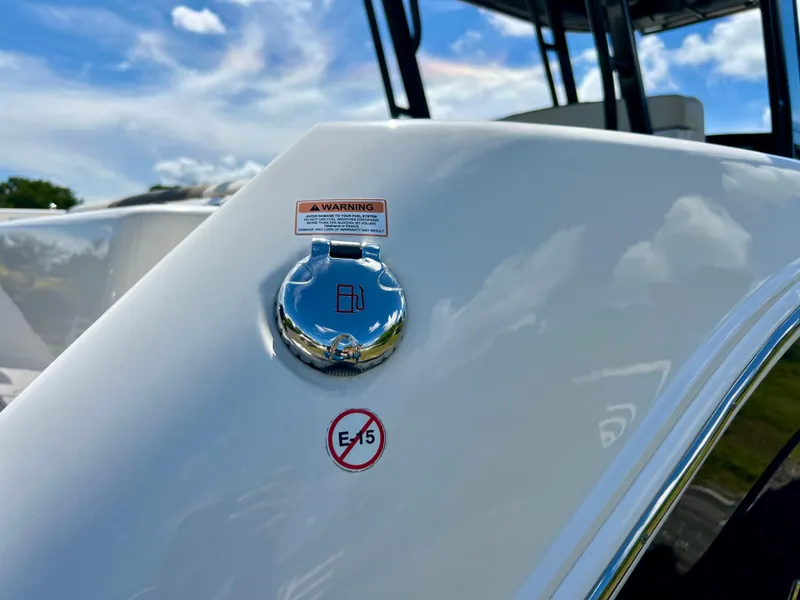 Slide: The Image of 2021 Robalo R272 Center Console fuel cap with E15 warning label. - 11
