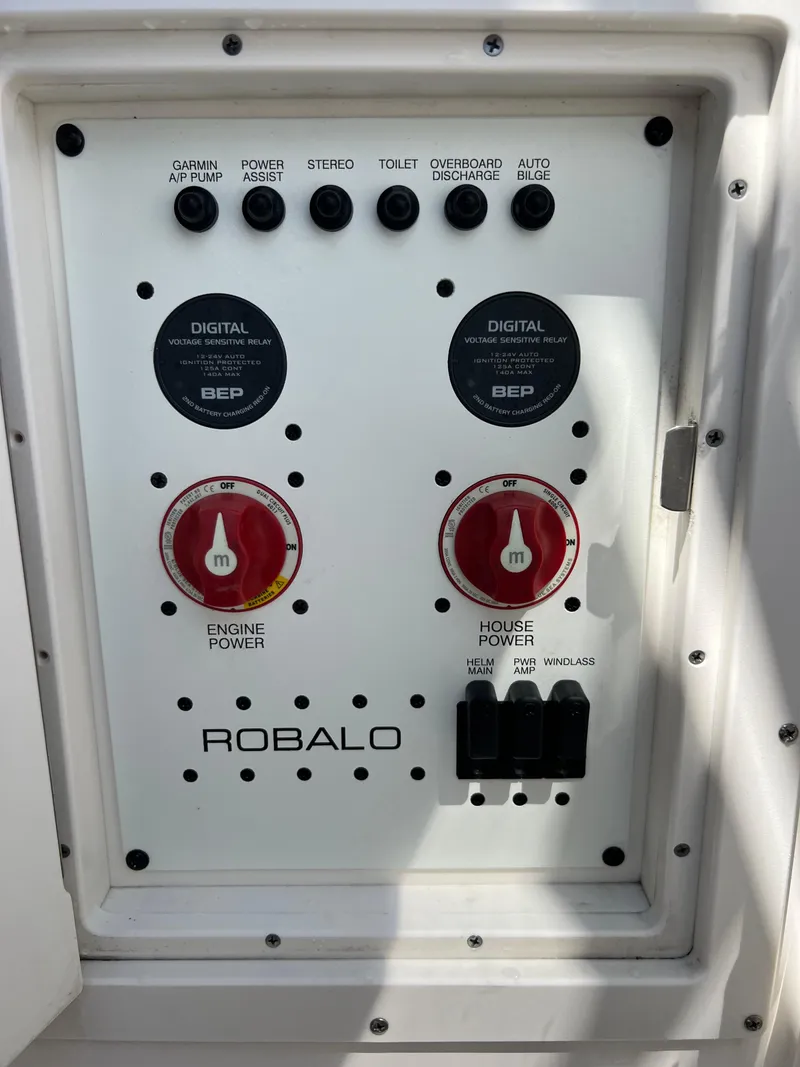 Slide: The Image of Control panel of 2021 Robalo R272 Center Console boat with power switches. - 12