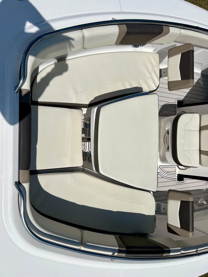 Slide: The Image of 2021 Robalo R272 Center Console boat interior with cushioned seating. - 17