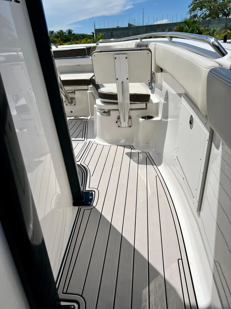 Slide: The Image of 2021 Robalo R272 Center Console boat interior with sleek seating and modern design. - 22