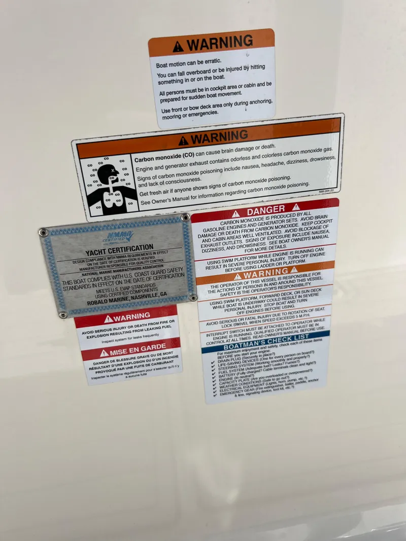 Slide: The Image of Warning and safety labels on a 2021 Robalo R272 Center Console boat. - 23