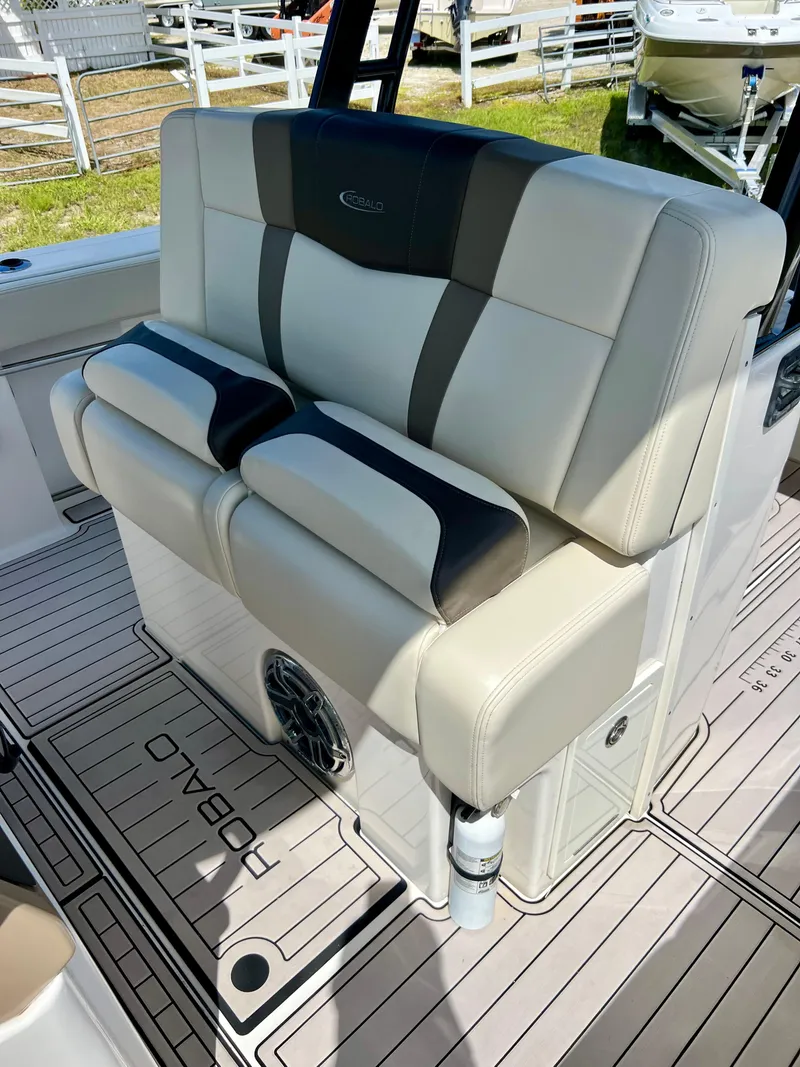 Slide: The Image of 2021 Robalo R272 Center Console boat seating with stylish upholstery. - 26