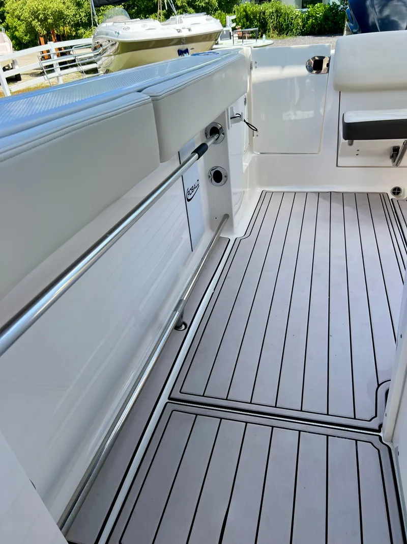 Slide: The Image of 2021 Robalo R272 Center Console boat interior with sleek deck design. - 28