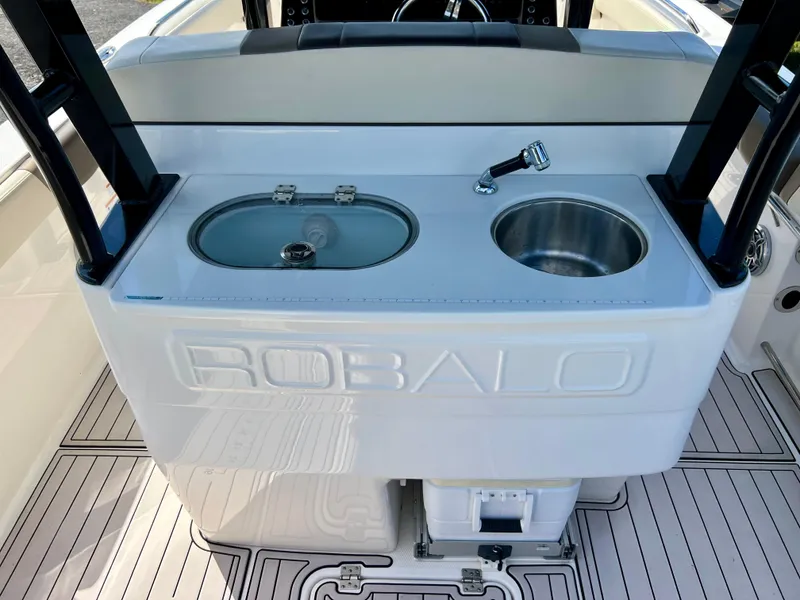 Slide: The Image of 2021 Robalo R272 Center Console boat sink and storage area. - 33