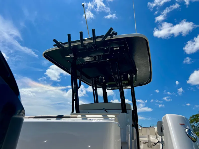 Slide: The Image of 2021 Robalo R272 Center Console boat under a clear blue sky. - 37
