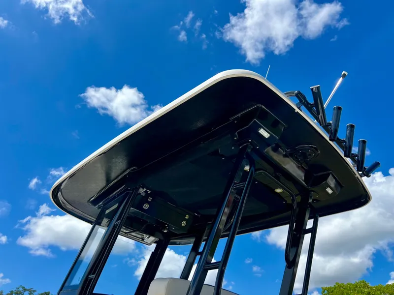 Slide: The Image of 2021 Robalo R272 Center Console boat against a bright blue sky. - 39