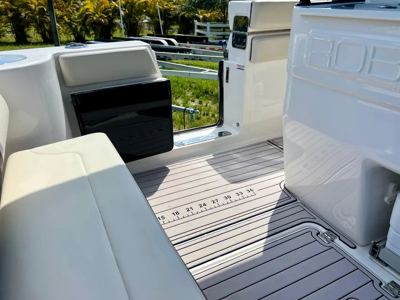 Slide: The Image of 2021 Robalo R272 Center Console boat interior with seating and deck view. - 41