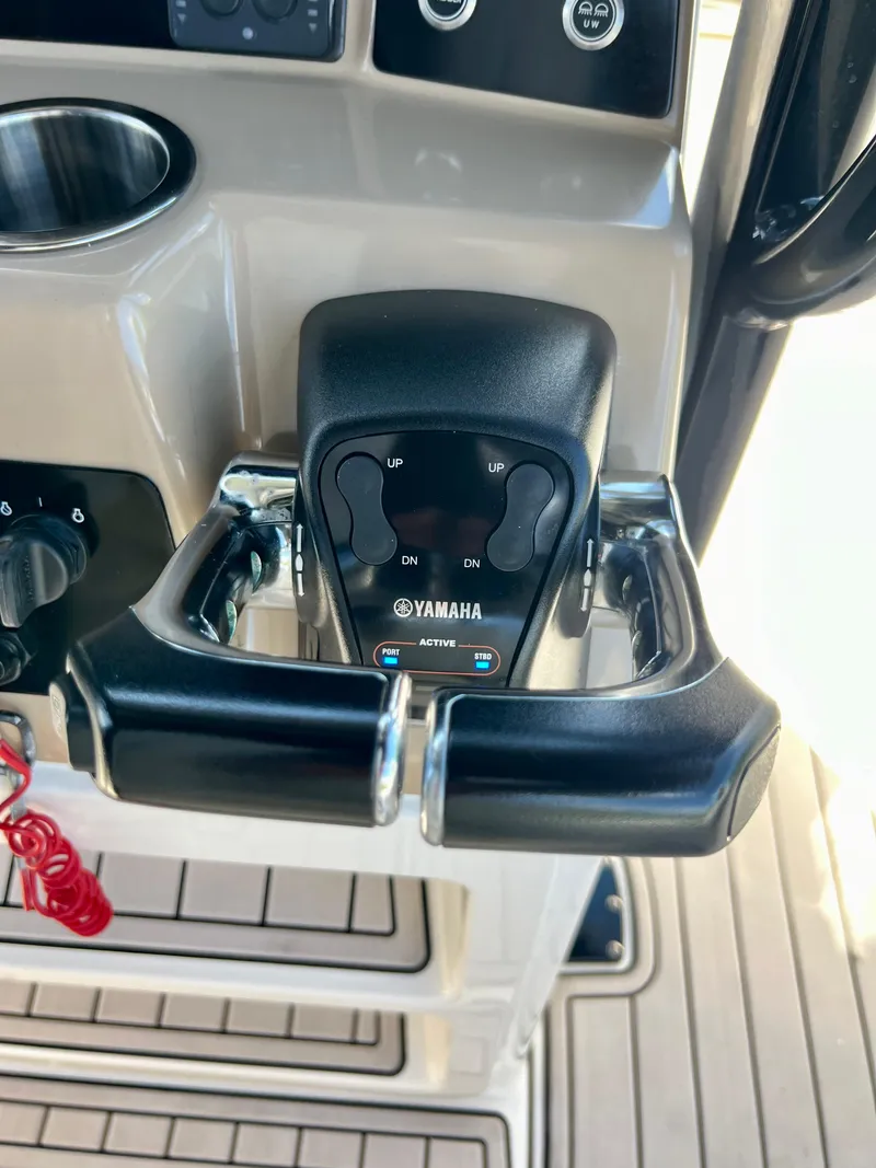 Slide: The Image of Close-up of Yamaha throttle controls on 2021 Robalo R272 Center Console boat. - 45