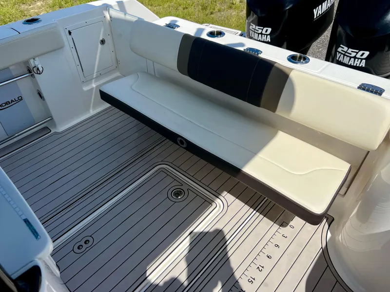 Slide: The Image of 2021 Robalo R272 Center Console boat interior with Yamaha engines and foldable seating. - 46