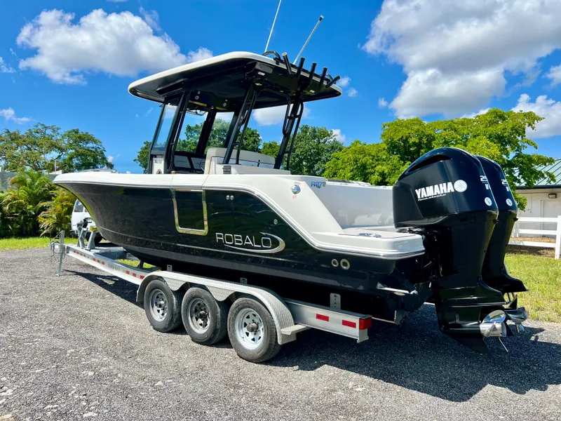 Slide: The Image of 2021 Robalo R272 Center Console boat on trailer, featuring Yamaha outboard motor. - 48