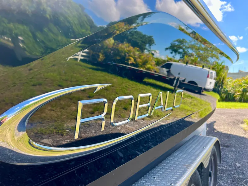 Slide: The Image of 2021 Robalo R272 Center Console boat with reflective black finish. - 6