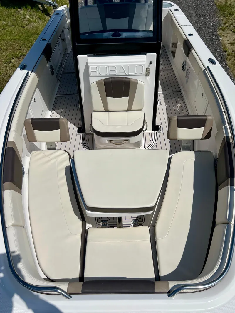 Slide: The Image of 2021 Robalo R272 Center Console boat interior with cushioned seating. - 9