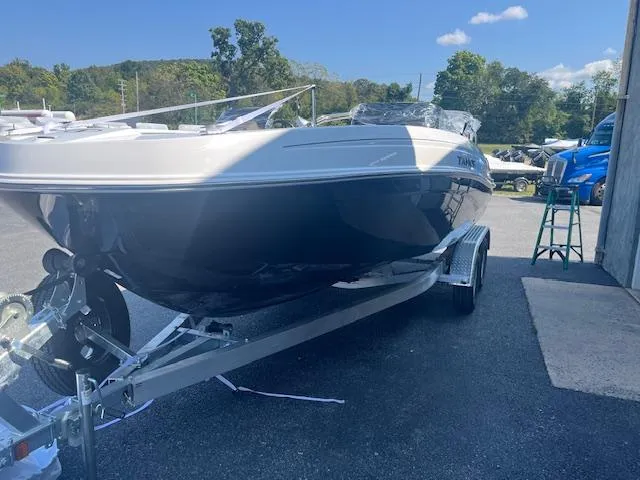 Slide: The Image of 2025 Tahoe T21 boat on trailer in outdoor setting. - 3