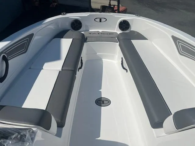 Slide: The Image of 2025 Tahoe T21 boat interior with gray seating and modern design. - 7