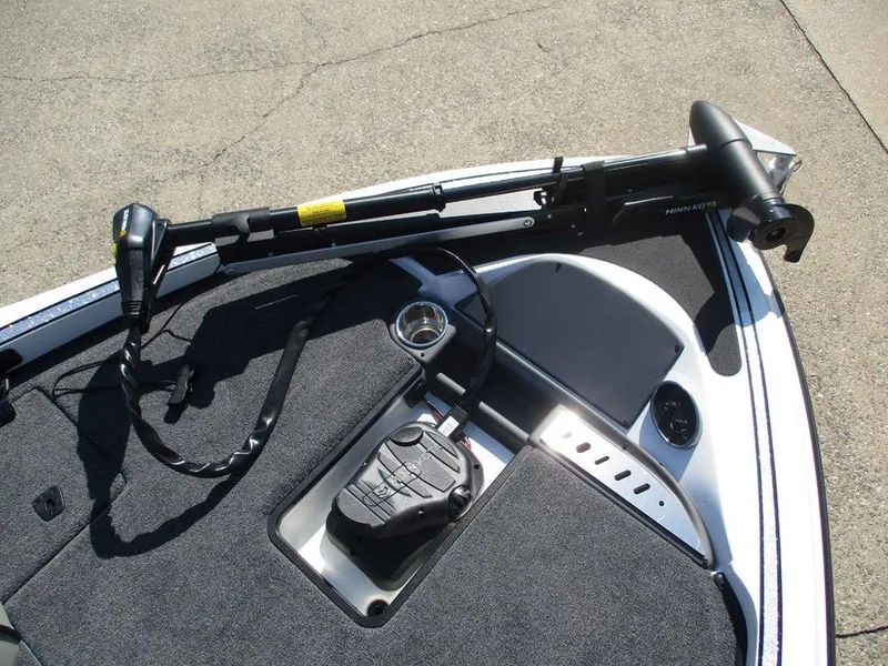 Slide: The Image of 2025 Triton 18 TrX boat deck with trolling motor and control panel. - 8