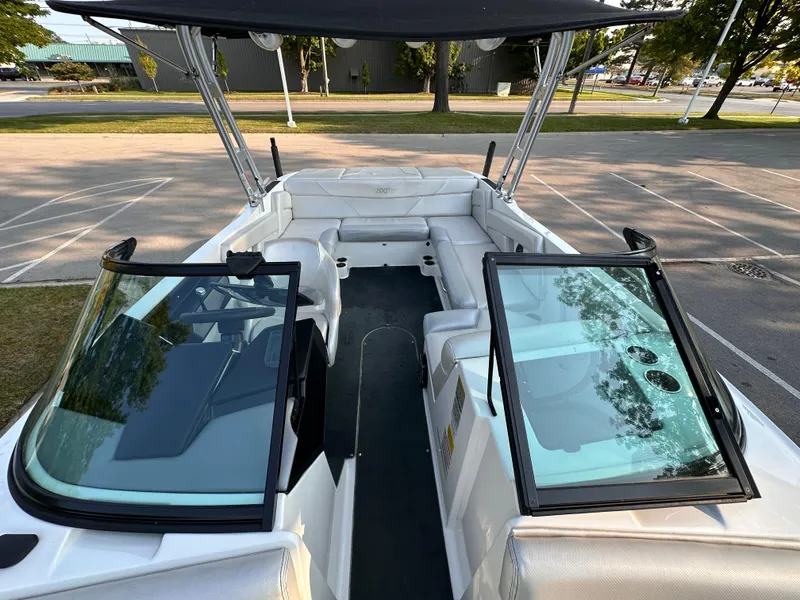 Slide: The Image of 2017 MasterCraft NXT22 boat interior with open windshield and spacious seating. - 14
