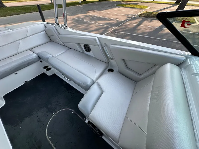 Slide: The Image of 2017 MasterCraft NXT22 boat interior with white seating and sleek design. - 15