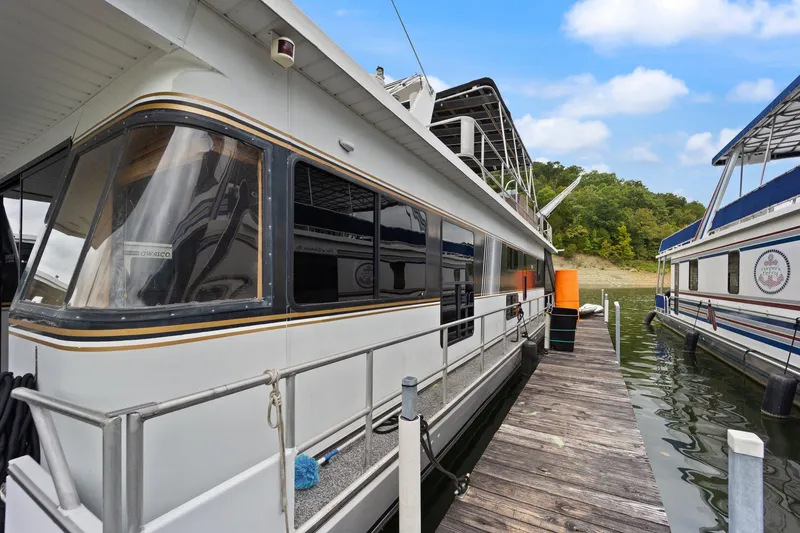 Slide: The Image of 2003 Monticello 18 X 70 River Yacht docked on a sunny day. - 17