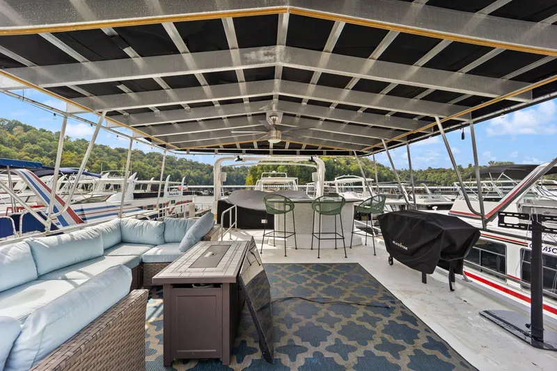 Slide: The Image of Spacious deck of 2003 Monticello 18 X 70 River Yacht with seating and scenic marina view. - 21