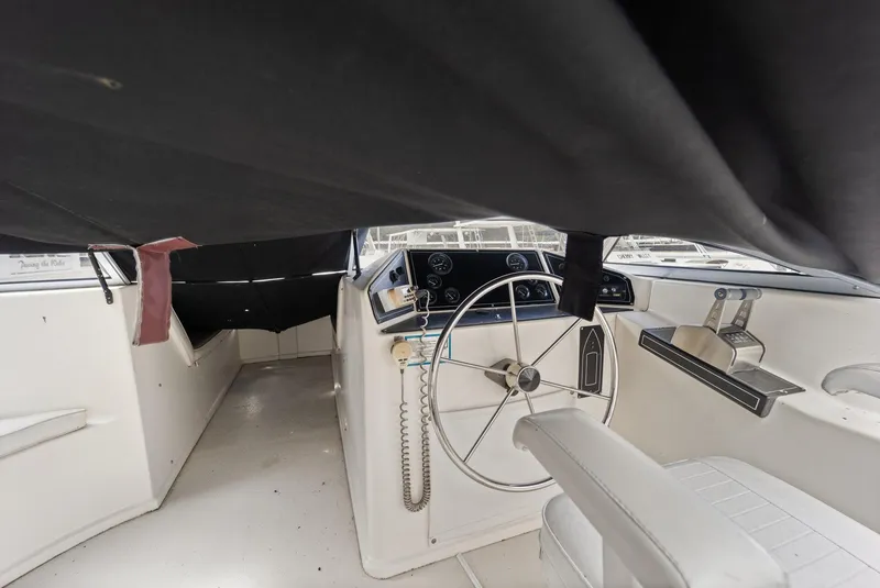 Slide: The Image of Interior of 2003 Monticello 18 X 70 River Yacht cockpit with steering wheel and controls. - 24