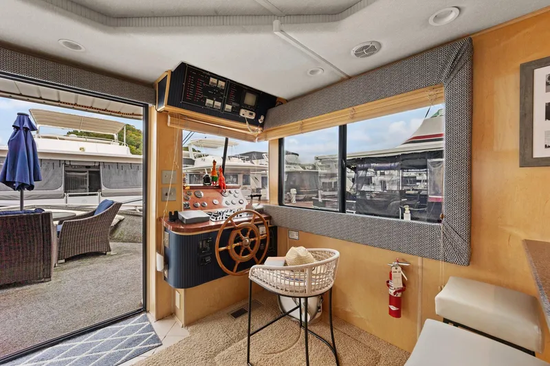 Slide: The Image of Interior of 2003 Monticello 18 X 70 River Yacht with helm and outdoor view. - 38