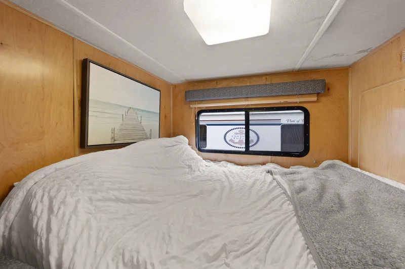 Slide: The Image of Cozy bedroom interior of 2003 Monticello 18 X 70 River Yacht with window view. - 42