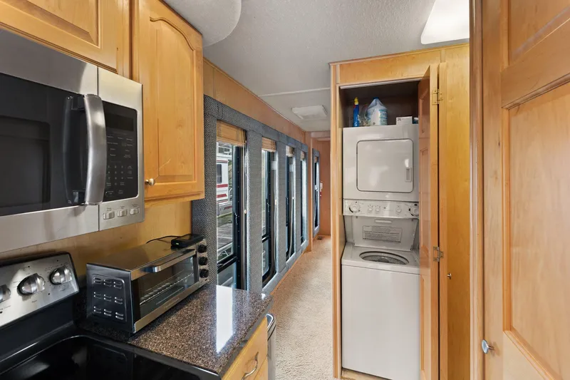 Slide: The Image of Interior of 2003 Monticello River Yacht with kitchen and laundry appliances. - 44