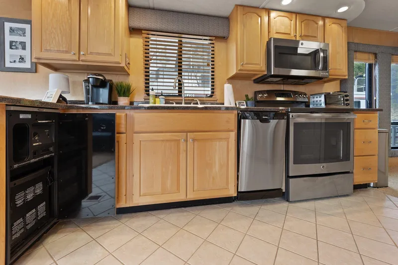 Slide: The Image of Modern kitchen in 2003 Monticello 18 X 70 River Yacht with stainless steel appliances. - 45