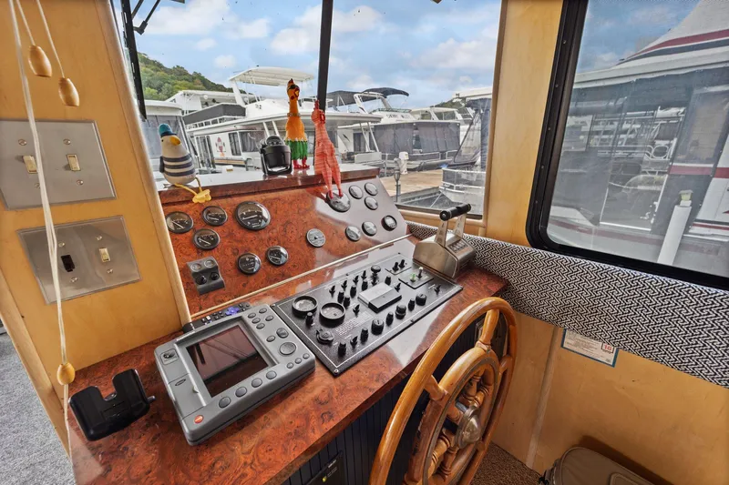 Slide: The Image of Control panel of 2003 Monticello 18 X 70 River Yacht with navigation instruments. - 46