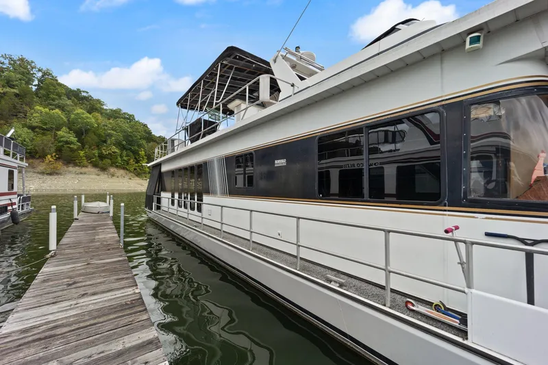 Slide: The Image of 2003 Monticello 18 X 70 River Yacht docked by a wooden pier. - 6