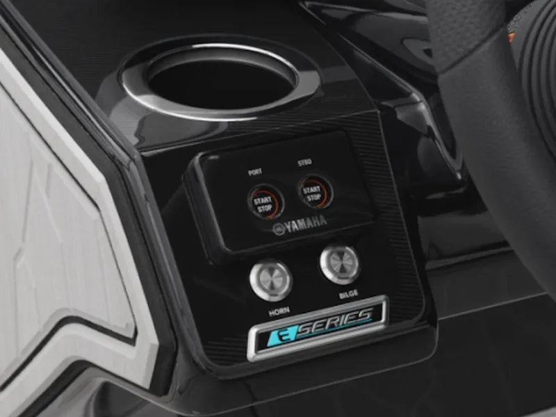 Slide: The Image of 2025 Yamaha Boats 252XE dashboard with controls and cup holder. - 10