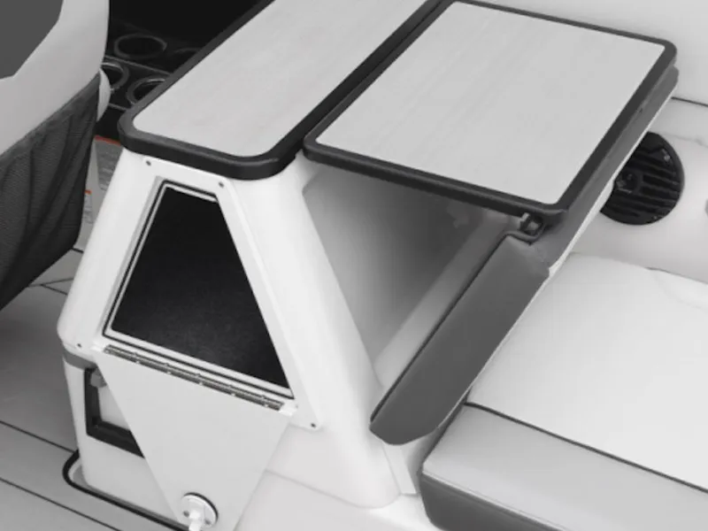Slide: The Image of 2025 Yamaha Boats 252XE interior storage compartment with sleek design and modern features. - 11