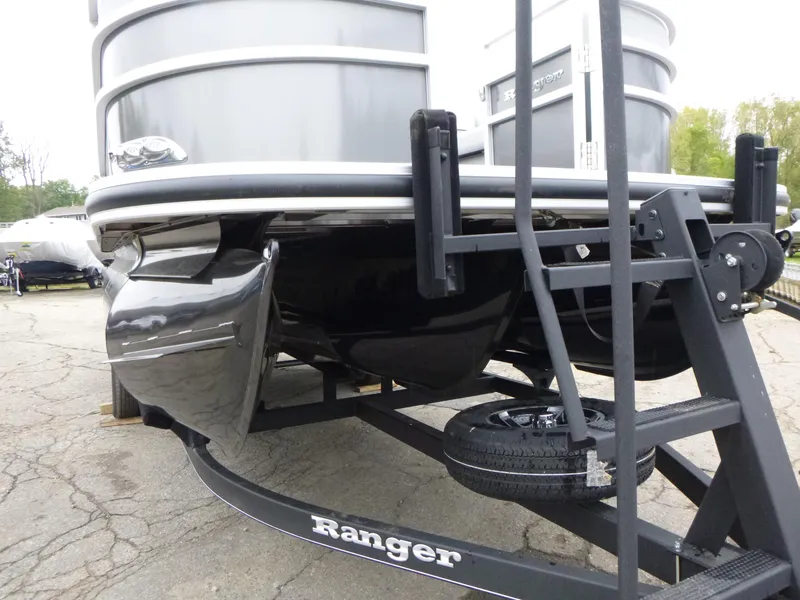 Slide: The Image of 2024 Ranger Reata 223C pontoon boat on trailer, close-up view. - 11