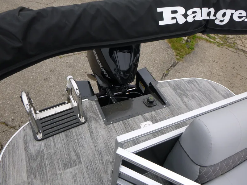 Slide: The Image of 2024 Ranger Reata 223C boat with motor and seating, featuring sleek design and durable materials. - 20